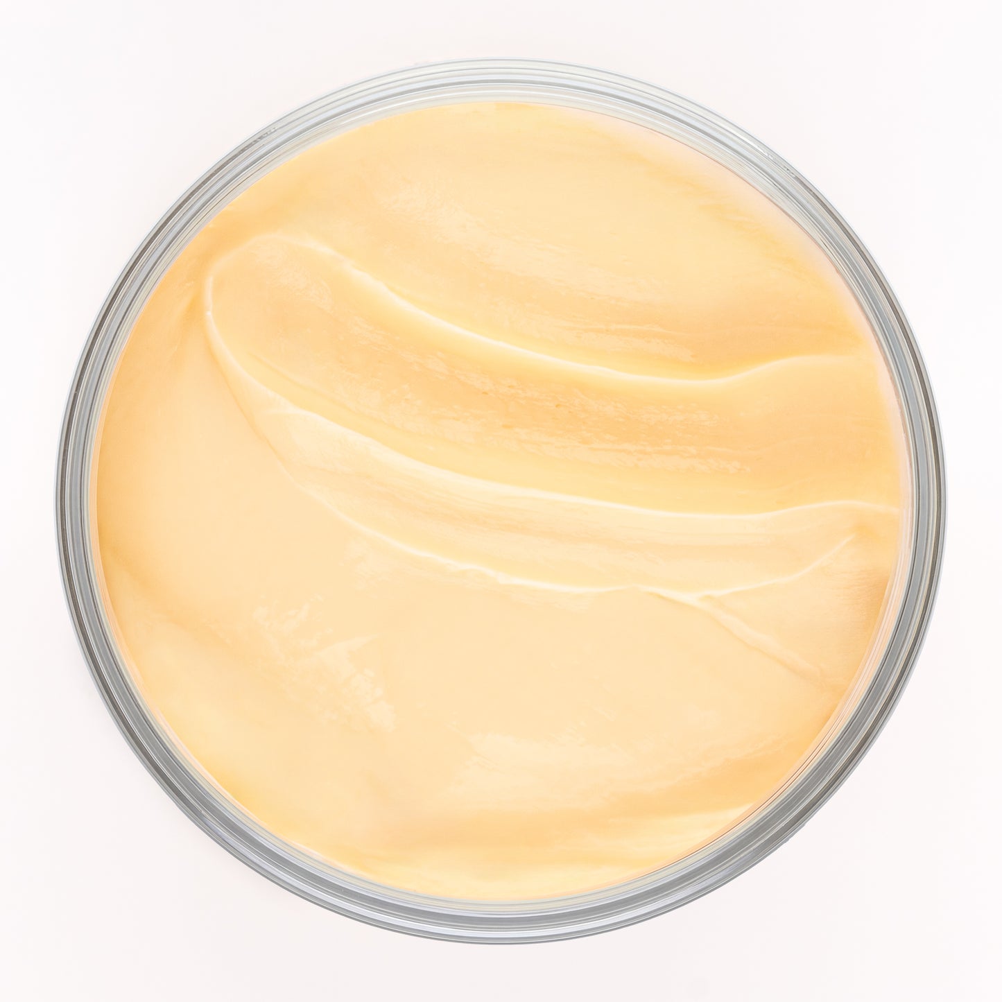 Visuel de la texture onctueuse de la Crème Soufflée Actiforce dans un pot vu de dessus sur fond clair