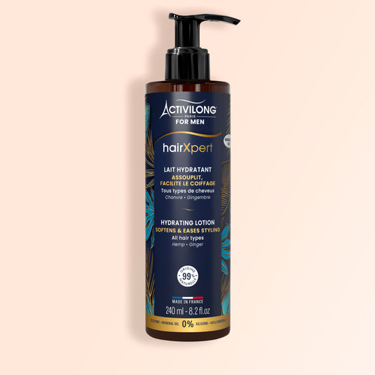 Lotion cheveux pour homme de la gamme HairXpert - Activilong For Men en flacon pompe ambré 240 ml, étiquette bleu marine à feuillages dorés