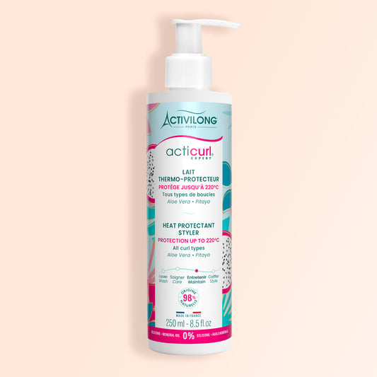 Packshot sur fond crème du flacon du lait thermo-protecteur Acticurl Expert pour cheveux bouclés