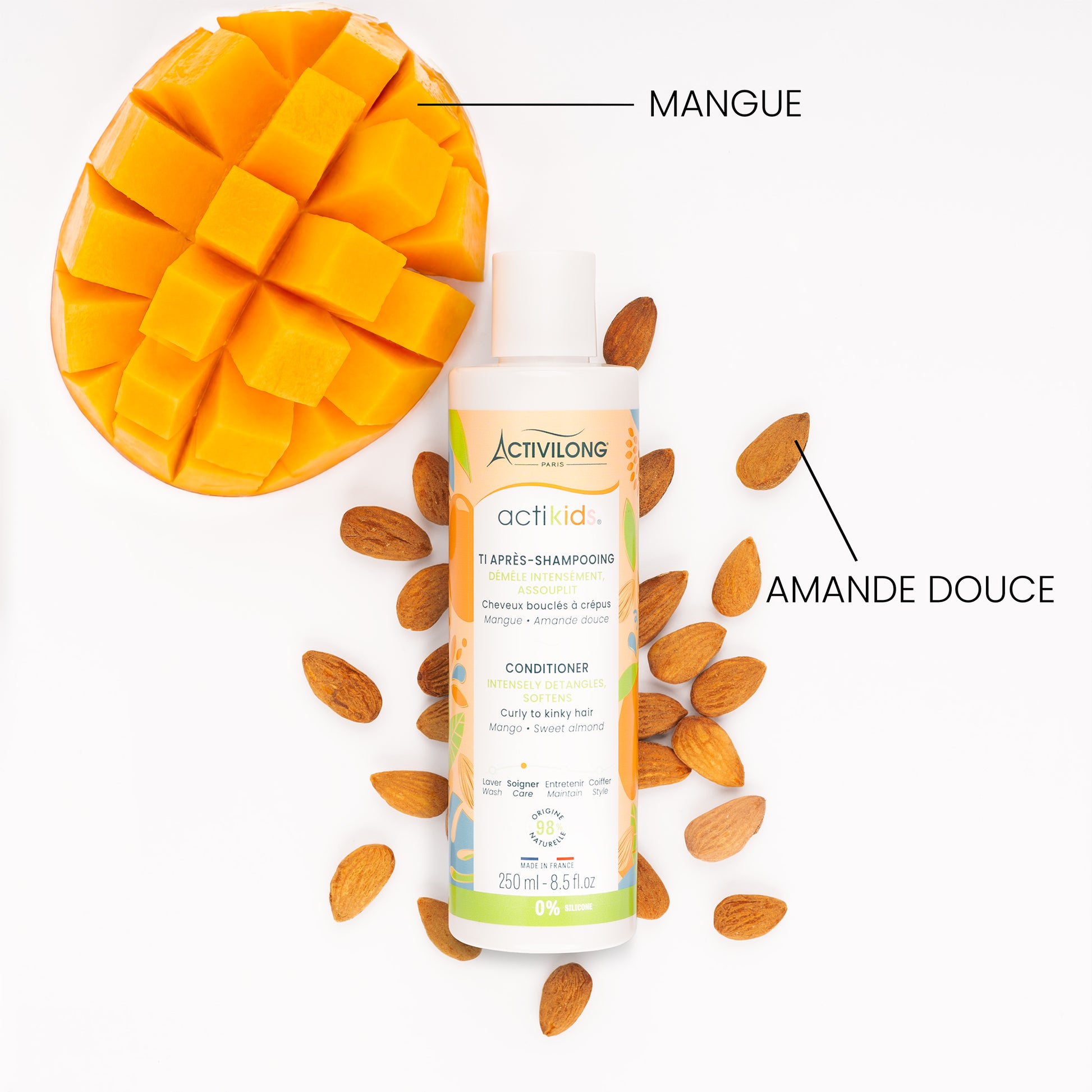 Visuel d'un Flacon du Ti Après-Shampooing Actikids entouré de ses actifs mangue et amande douce